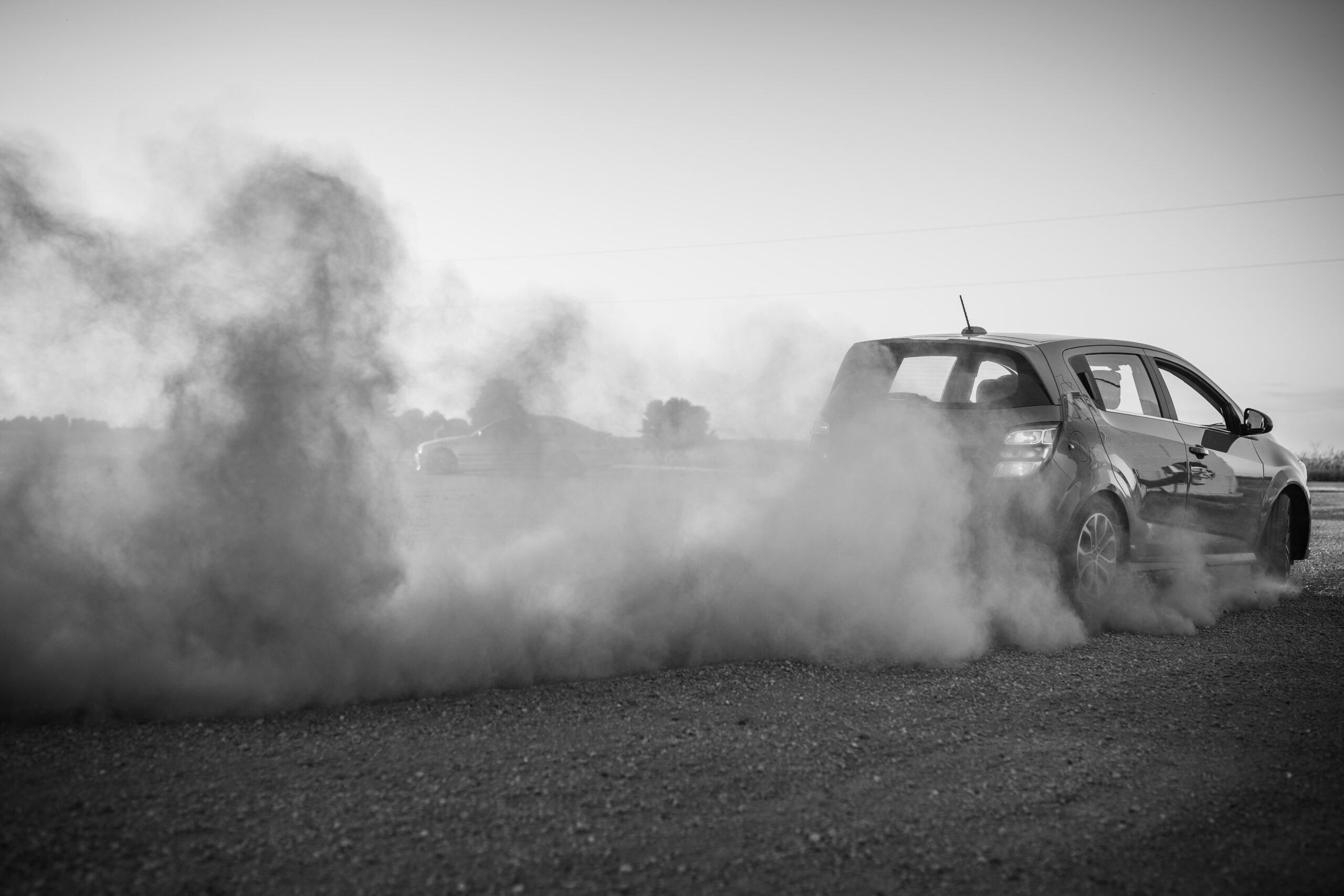 grayscale photo of car on road